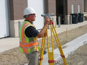 Surveyor taking measurements